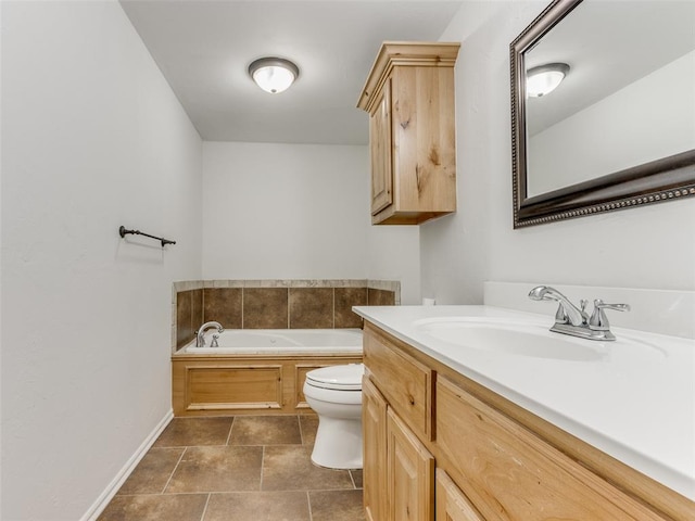 bathroom with tile patterned flooring, vanity, a bath, and toilet