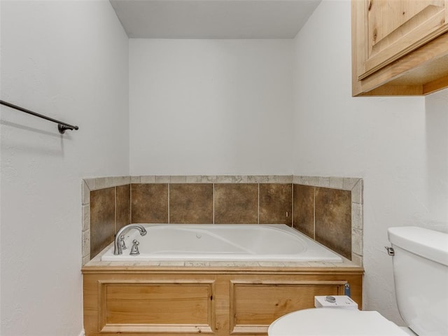 bathroom with toilet and a bathtub