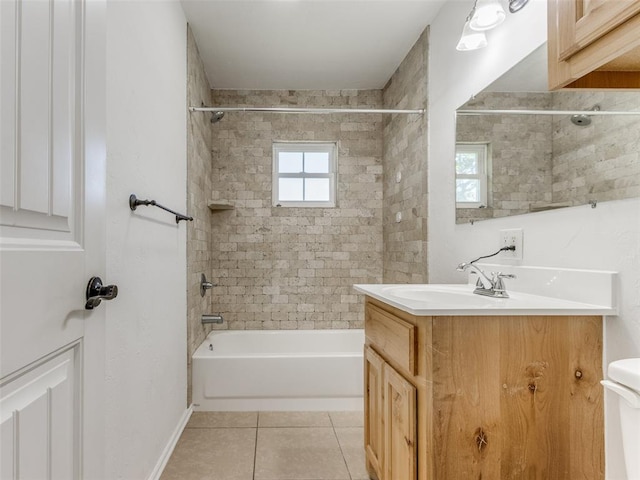 full bathroom with tile patterned floors, vanity, toilet, and tiled shower / bath combo