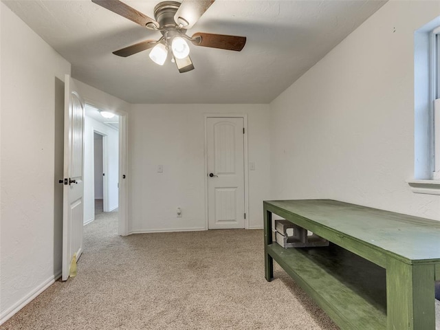 bedroom featuring ceiling fan and light colored carpet