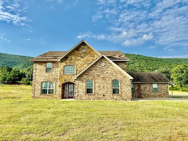 front facade with a front yard