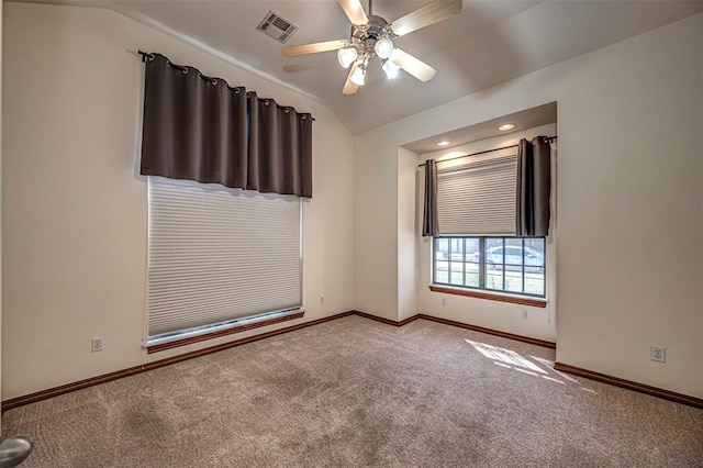 spare room with ceiling fan, carpet floors, and lofted ceiling