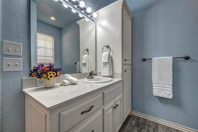 bathroom featuring vanity and wood-type flooring