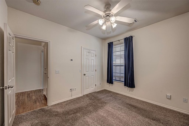 unfurnished bedroom with carpet, ceiling fan, and a closet