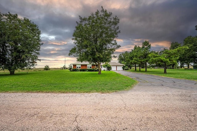 view of front of home with a yard