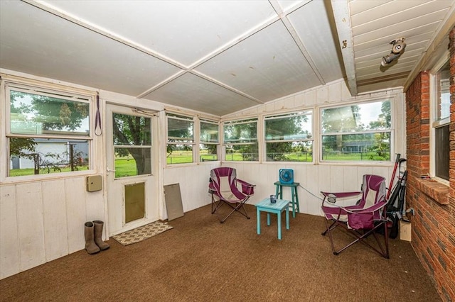 sunroom / solarium featuring a wealth of natural light and lofted ceiling