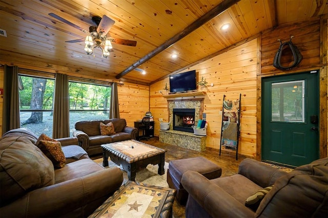 living room with vaulted ceiling with beams, wood walls, wood ceiling, and ceiling fan