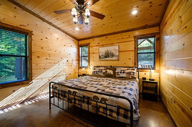 bedroom featuring wood walls and vaulted ceiling