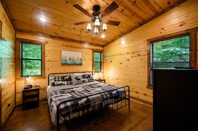 bedroom with multiple windows and wood walls