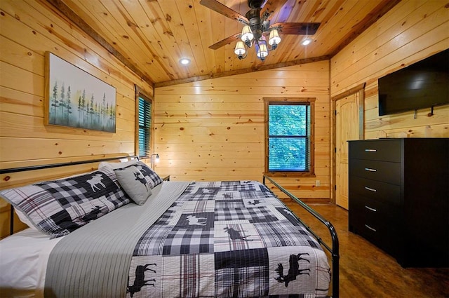 bedroom featuring ceiling fan, wood walls, wooden ceiling, and vaulted ceiling