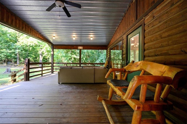 wooden terrace featuring ceiling fan