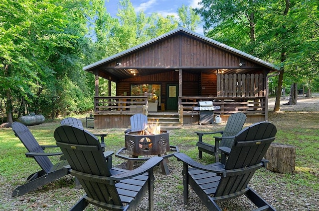 exterior space featuring area for grilling and an outdoor fire pit