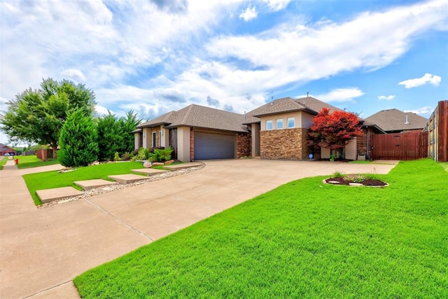 view of front facade featuring a garage and a front lawn