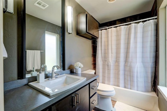 full bathroom featuring vanity, toilet, and shower / bath combo