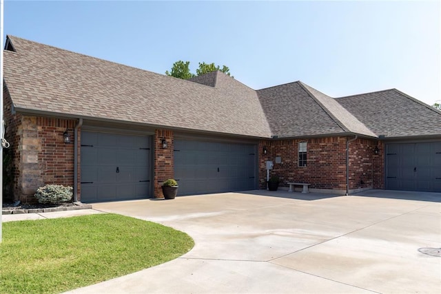 single story home featuring a garage