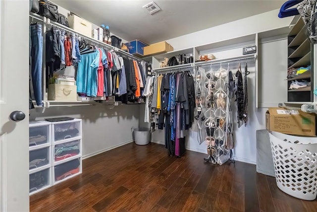 walk in closet with wood-type flooring