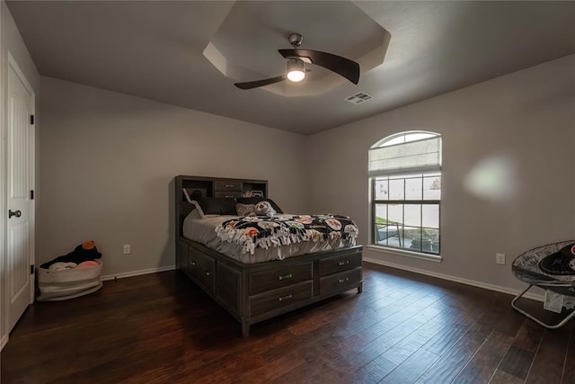 bedroom featuring dark hardwood / wood-style floors and ceiling fan