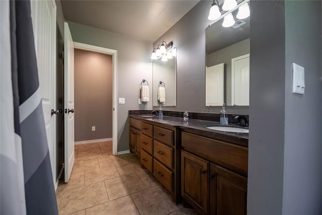 bathroom featuring tile patterned flooring and vanity