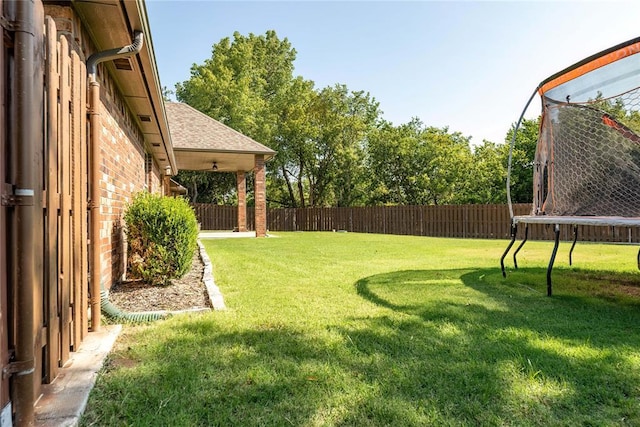 view of yard featuring a trampoline