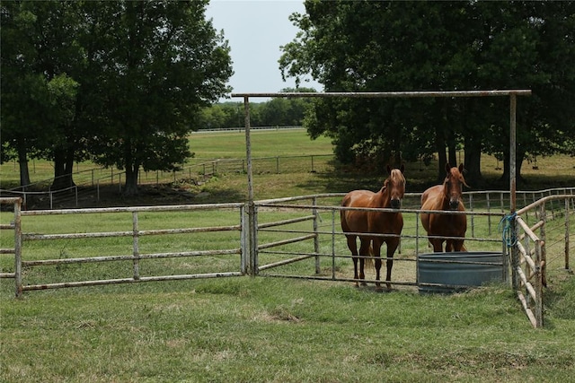 view of stable featuring a rural view