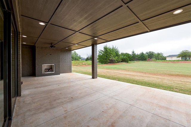 view of patio / terrace with an outdoor brick fireplace