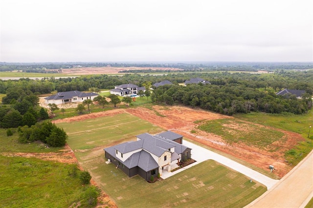 birds eye view of property with a rural view