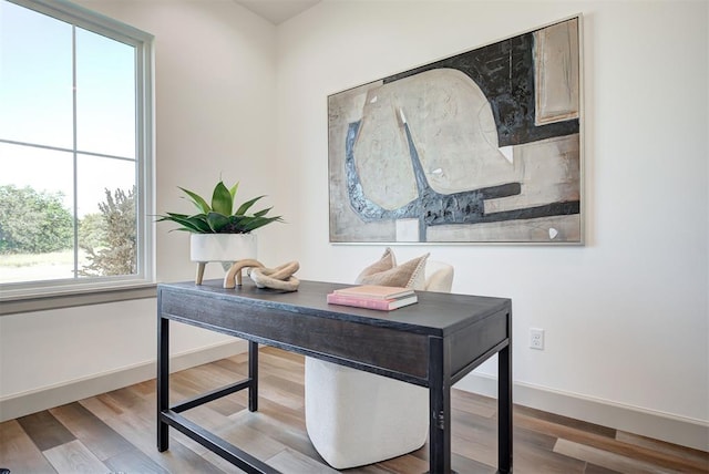 office area with hardwood / wood-style floors