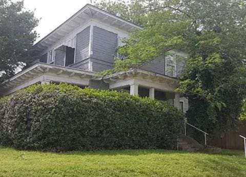 view of home's exterior featuring a yard