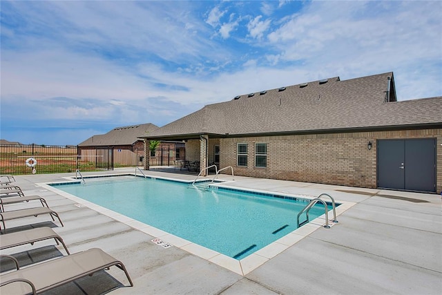 view of swimming pool with a patio