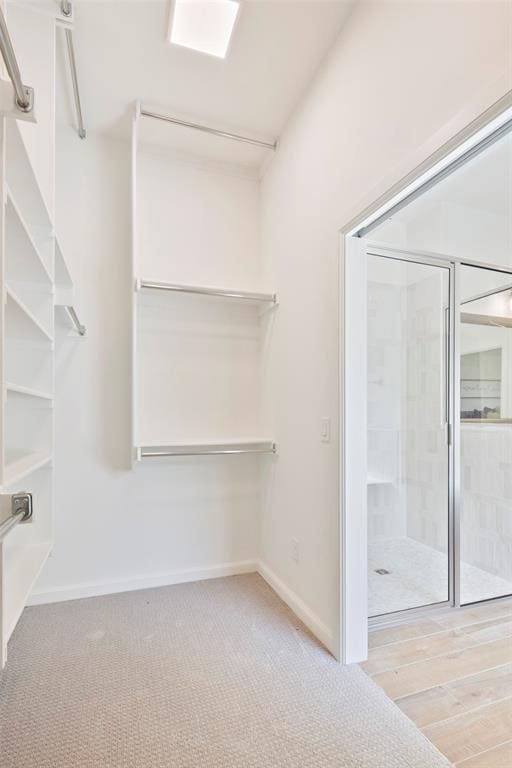 spacious closet with light wood-type flooring