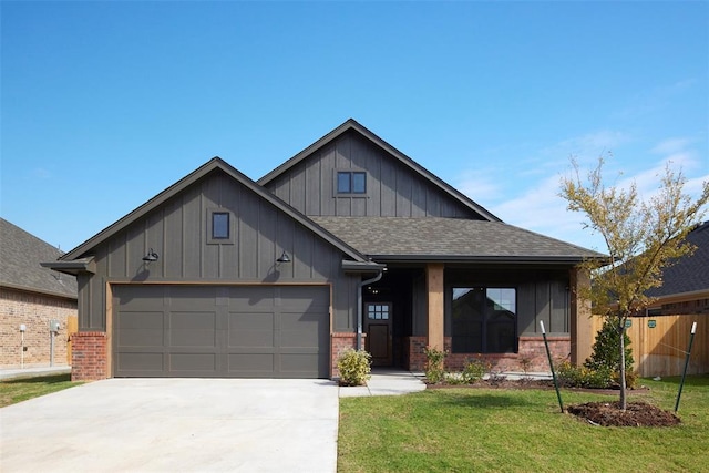 view of front of house with a front yard and a garage