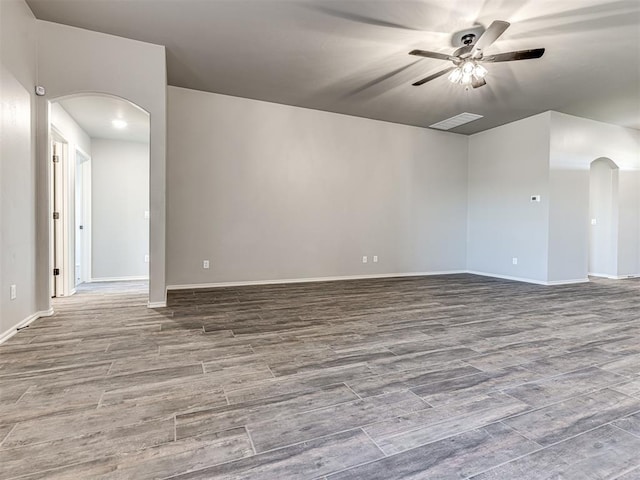 spare room featuring ceiling fan and wood-type flooring