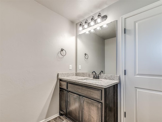 bathroom featuring vanity and hardwood / wood-style flooring