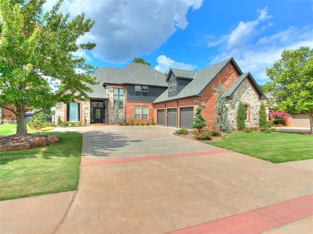 view of front of house with a garage and a front lawn