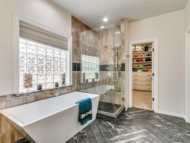 bathroom featuring built in shelves and plus walk in shower