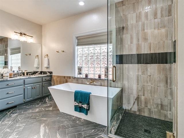 bathroom with vanity and plus walk in shower