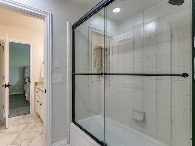 bathroom with bath / shower combo with glass door