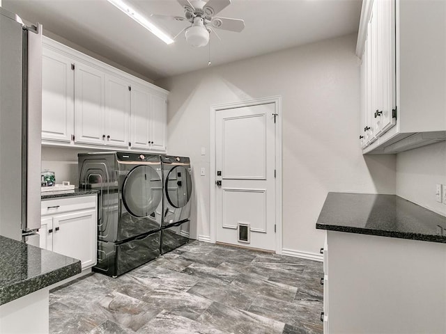 laundry area featuring washer and dryer, ceiling fan, and cabinets