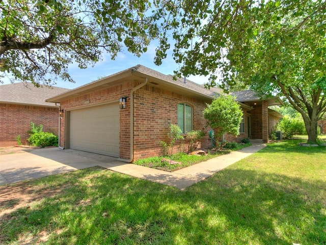 ranch-style house with a garage and a front yard