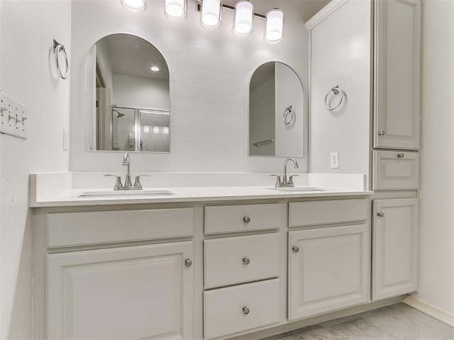 bathroom with vanity and an enclosed shower