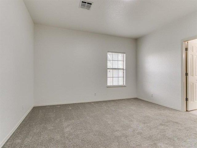 empty room featuring light carpet