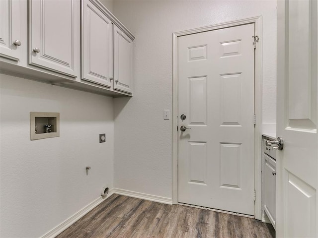 laundry room featuring hookup for an electric dryer, dark hardwood / wood-style floors, cabinets, and hookup for a washing machine