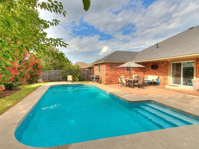 view of pool featuring a patio