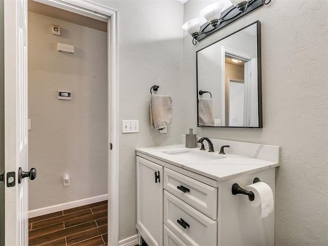 bathroom featuring vanity and hardwood / wood-style flooring