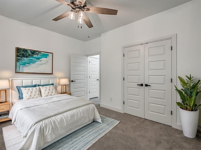 carpeted bedroom with a closet and ceiling fan