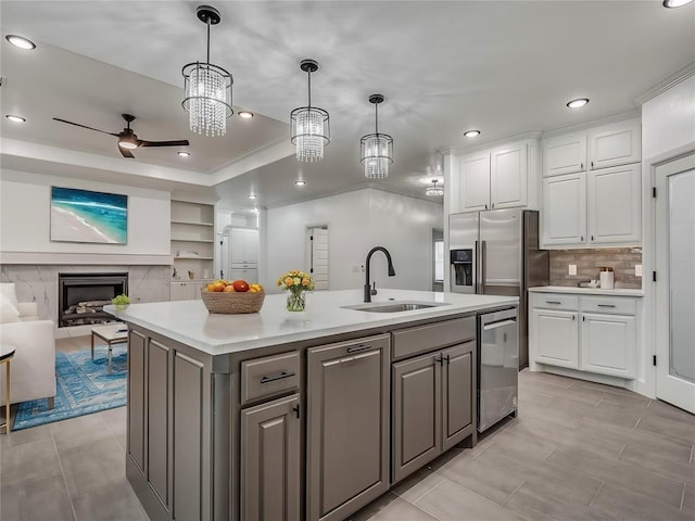 kitchen with sink, stainless steel appliances, white cabinetry, and gray cabinets