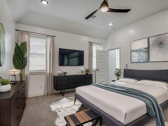 carpeted bedroom with ceiling fan and lofted ceiling