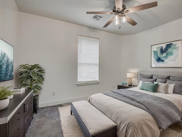 bedroom featuring ceiling fan and light colored carpet