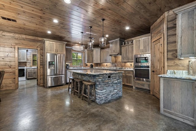 kitchen with wooden ceiling, pendant lighting, wooden walls, a kitchen island, and appliances with stainless steel finishes