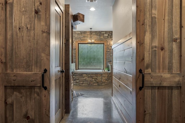 corridor with concrete flooring